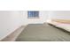 This bedroom features a minimalist design and neutral paint color at 20 S Logan St # 104, Denver, CO 80209