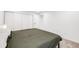 This bedroom features a minimalist design and neutral paint color at 20 S Logan St # 104, Denver, CO 80209