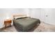 This bedroom features a minimalist design, carpet floors, and plenty of natural light at 20 S Logan St # 104, Denver, CO 80209