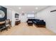 Comfortable living room with hardwood floors, sectional sofa, and desk at 20 S Logan St # 104, Denver, CO 80209