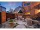 Outdoor seating area with stone table and decorative iron gazebo at 20 S Logan St # 104, Denver, CO 80209