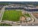 Aerial view showcases a green park area among colorful modern buildings at 630 E Hinsdale Ave, Littleton, CO 80122