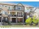 Modern townhome with a blend of brick and siding, featuring a private balcony and inviting curb appeal at 630 E Hinsdale Ave, Littleton, CO 80122