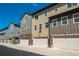 Townhome exterior displaying private garages and a well-kept facade at 630 E Hinsdale Ave, Littleton, CO 80122