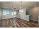 Spacious living room with hardwood floors, natural light, and a ceiling fan, creating a comfortable atmosphere at 630 E Hinsdale Ave, Littleton, CO 80122