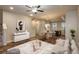 Inviting living room with stylish decor, flowing into a dining area and kitchen for seamless entertaining at 630 E Hinsdale Ave, Littleton, CO 80122