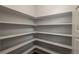 Well-organized walk-in pantry with ample shelving, maximizing storage space for a tidy kitchen at 630 E Hinsdale Ave, Littleton, CO 80122