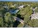 Overhead shot featuring pool, tennis court, foot bridge and lush green trees in community at 6810 E Appleton Ct, Centennial, CO 80112
