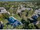 An aerial view shows a pool and clubhouse surrounded by mature trees near the residences at 6810 E Appleton Ct, Centennial, CO 80112