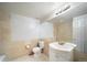 Bathroom with tan tiles and vanity sink at 6810 E Appleton Ct, Centennial, CO 80112