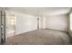 Bedroom with light gray carpet and white walls with a view of the bathroom at 6810 E Appleton Ct, Centennial, CO 80112