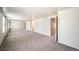 Bedroom with light gray carpet and white walls, and mirrored closet at 6810 E Appleton Ct, Centennial, CO 80112