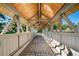 Covered bridge with wood beam construction and plank flooring provides a unique community feature at 6810 E Appleton Ct, Centennial, CO 80112