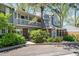 Charming townhome with a brick facade, balcony, and well-maintained landscaping in a tranquil setting at 6810 E Appleton Ct, Centennial, CO 80112