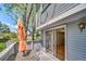 Exterior view of the patio, sliding door, and side of house with tree line, blending outdoor-indoor living at 6810 E Appleton Ct, Centennial, CO 80112