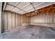 Spacious two-car garage with unfinished walls and concrete floor ready for customization at 6810 E Appleton Ct, Centennial, CO 80112