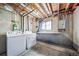 Basement laundry area featuring a washer, dryer, utility sink and storage at 6810 E Appleton Ct, Centennial, CO 80112