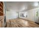 Spacious living room with hardwood floors, a built-in fireplace, and ample natural light at 6810 E Appleton Ct, Centennial, CO 80112