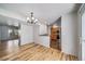 Bright living room with hardwood floors and view of kitchen, creating an open and inviting space at 6810 E Appleton Ct, Centennial, CO 80112