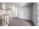 Living room with gray carpet and white walls at 6810 E Appleton Ct, Centennial, CO 80112