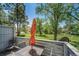 Outdoor patio area with seating, offering views of well-maintained lawn and mature trees at 6810 E Appleton Ct, Centennial, CO 80112