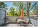 Outdoor patio with seating area overlooking lush greenery, perfect for relaxing and enjoying nature at 6810 E Appleton Ct, Centennial, CO 80112