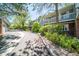 A quiet street view of townhomes, showcasing well-maintained exteriors, balconies, and mature trees at 6810 E Appleton Ct, Centennial, CO 80112