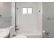 Bright bathroom with white subway tiles and a bathtub at 17769 E Purdue Pl, Aurora, CO 80013