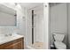 Basement bathroom with a shower and pedestal sink at 17769 E Purdue Pl, Aurora, CO 80013