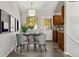 Small dining area with gray chairs and wooden cabinets at 17769 E Purdue Pl, Aurora, CO 80013