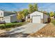 Attached garage with a long driveway at 17769 E Purdue Pl, Aurora, CO 80013