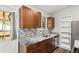 Clean kitchen with granite counters and wood cabinets at 17769 E Purdue Pl, Aurora, CO 80013