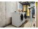 Basement laundry room with side-by-side washer and dryer at 17769 E Purdue Pl, Aurora, CO 80013