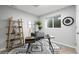 Functional basement office with a desk and shelving at 17769 E Purdue Pl, Aurora, CO 80013