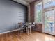 Dining area with exposed brick and natural light at 1301 Wazee St # 2D, Denver, CO 80204