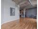 Open-concept living space with hardwood floors and modern decor at 1301 Wazee St # 2D, Denver, CO 80204