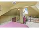 Lofted space with a unique ceiling, with cozy decor, including a small storage cabinet at 3941 S Elati St, Englewood, CO 80110