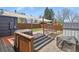 Backyard featuring an outdoor dining area with sunshade and a metal frame hammock at 3941 S Elati St, Englewood, CO 80110