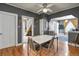 Open dining room with hardwood floors, white trim and modern lighting at 3941 S Elati St, Englewood, CO 80110