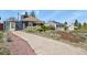 Inviting property with mature landscaping and a long private driveway at 3941 S Elati St, Englewood, CO 80110