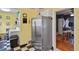 Spacious kitchen with stainless steel appliances and a large refrigerator at 3941 S Elati St, Englewood, CO 80110