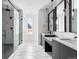 Bathroom featuring a glass shower enclosure, stylish vanity with black accents and a view to the outside at 5258 Lions Paw St, Castle Rock, CO 80104