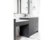 Close-up of bathroom vanity showcasing modern design, sleek countertop, and black hardware at 5258 Lions Paw St, Castle Rock, CO 80104
