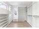 Spacious walk-in closet with custom shelving, drawers, and ample storage space at 5258 Lions Paw St, Castle Rock, CO 80104