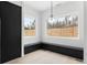 Cozy dining nook with ample natural light, built in bench seating and modern light fixture at 5258 Lions Paw St, Castle Rock, CO 80104