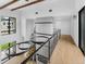 Hallway with modern lighting and wood floors at 5258 Lions Paw St, Castle Rock, CO 80104