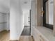 Hallway with wood floors and built-in storage at 5258 Lions Paw St, Castle Rock, CO 80104