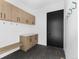 Mudroom with built-in storage, seating, and modern finishes at 5258 Lions Paw St, Castle Rock, CO 80104