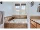 Bathroom with soaking tub and tile surround at 5818 S Urban Way, Littleton, CO 80127