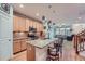 Modern kitchen with light wood cabinets, granite countertops, and stainless steel appliances at 5818 S Urban Way, Littleton, CO 80127